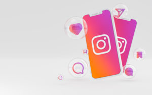 Instagram para clínicas: todos os recursos que você precisa conhecer 1 Dois celulares com Instagram aberto com ícones do app em sua volta